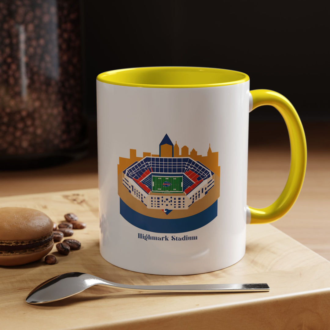 Yellow Highmark Stadium Coffee and Tea Mug displaying a wrap-around stadium design in high detail, placed in warm sunlight on a casual breakfast table. The cheerful yellow ceramic gives the mug a lively personality, making it great for fans who like unique and uplifting team merchandise that brightens daily routines and adds color to kitchen or office spaces.
