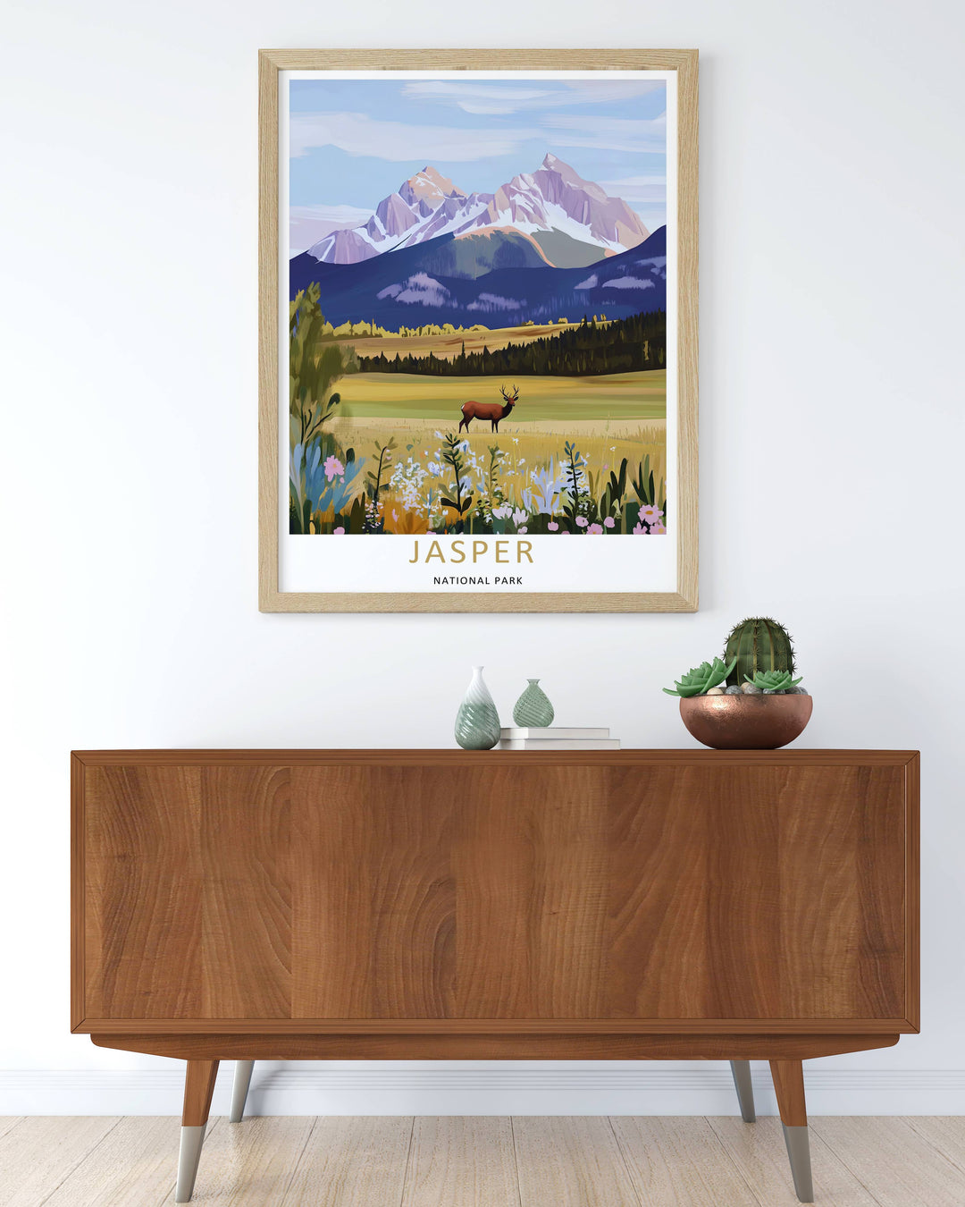 Modern wall art featuring a retro screen print style layout of a wild elk and the classic alpine mountain ranges in Jasper National Park, which can be ordered as a stretched canvas, an unframed poster, or a pure gold framed luxury print.