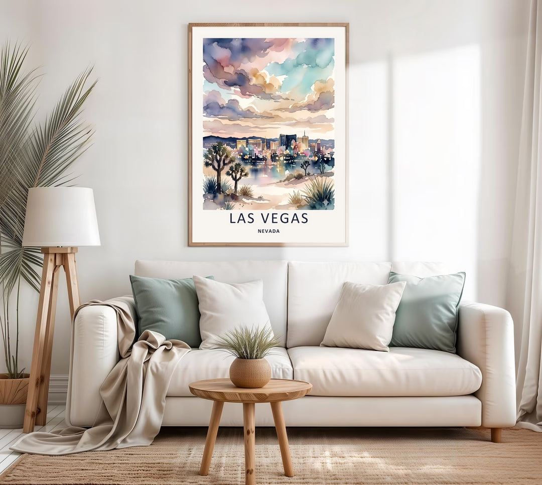 Watercolor painting of Las Vegas city landmarks at sunset. The art print features soft pastel cloud structures, desert plants, and deep indigo navy text centered on a warm ivory lithograph border margin.