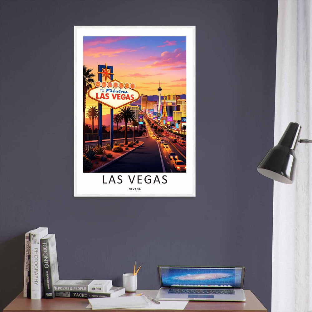 Retro Las Vegas sign and skyline vector print displayed in a modern black frame. The artwork features warm orange, pink, and purple sunset clouds over headlights moving down the strip.