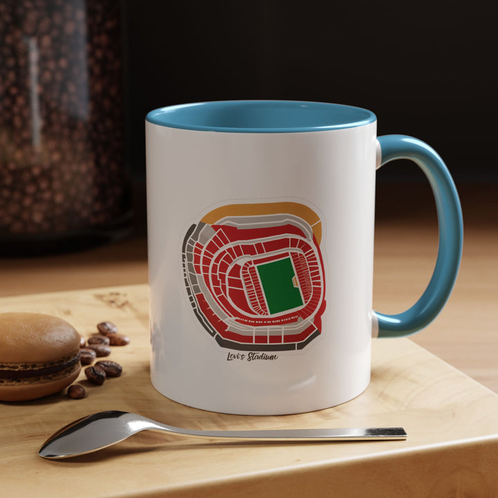 A blue Levi’s Stadium ceramic mug decorated with a panoramic stadium illustration. Photographed in a calm, relaxed environment, ideal for fans who enjoy representing their team subtly but proudly. The soothing blue tone contrasts with the detailed stadium artwork, making it a thoughtful everyday drinkware piece.
