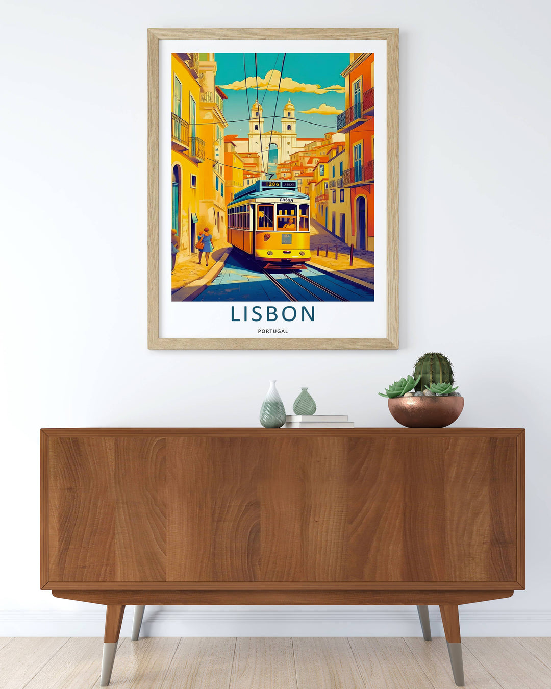 Linear perspective print detailing a steep Lisbon cobblestone road with a yellow streetcar centered in the frame, flanked by multi-story residential blocks under stylized geometric clouds.