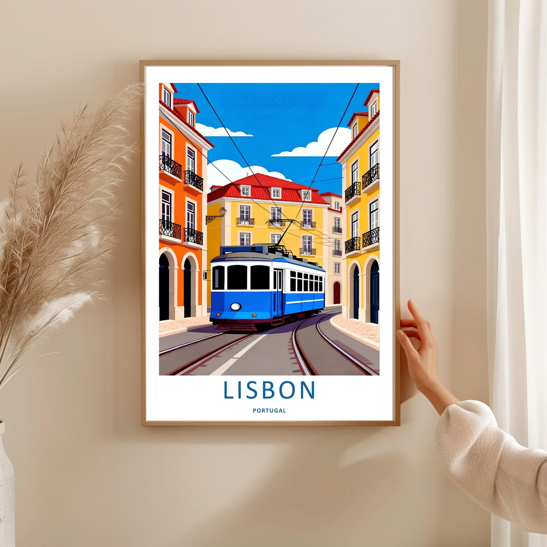 Editorial product shot of a framed Lisbon wall art print by MapYourDreams, displaying a clean blue streetcar navigating a curved cobblestone road beneath a blue sky.
