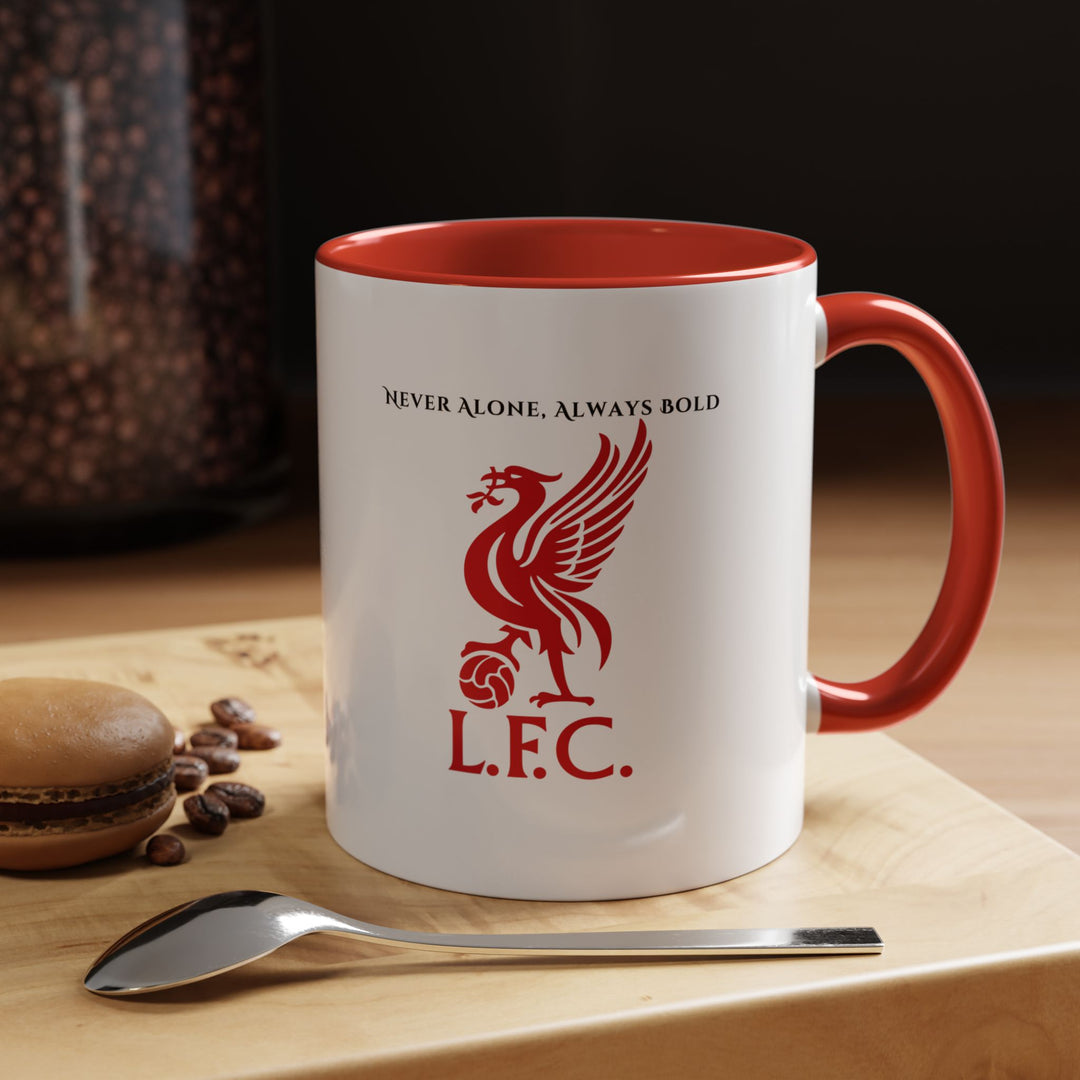 A red Liverpool FC ceramic mug featuring the club’s official crest printed in crisp detail. Photographed in a warm and spirited setting that evokes match-day excitement. Perfect for Reds supporters who enjoy showing their club pride during morning coffee or evening tea, bringing the energy and tradition of Anfield into everyday life.