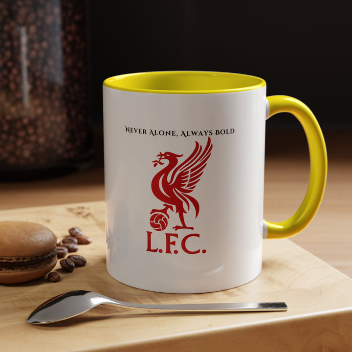 A bright yellow Liverpool FC mug featuring the club crest, styled in a sunny, cheerful setting that reflects optimism and enthusiasm. Perfect for fans who want their morning coffee or match-day tea to feel energized and uplifting, keeping the spirit of Liverpool close in every sip.