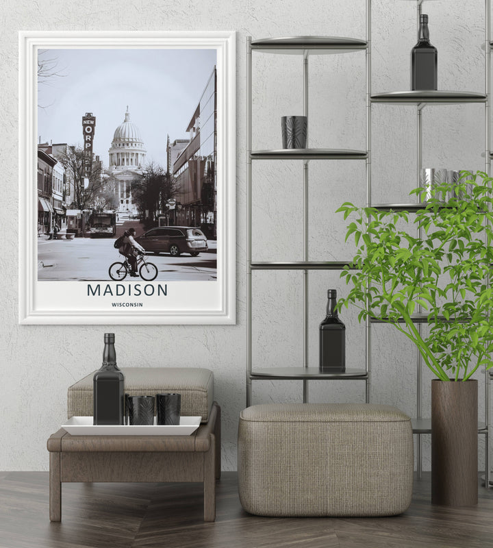 High-contrast black and white urban decor featuring a lone cyclist on State Street with the majestic dome of the Wisconsin State Capitol building rising behind trees, purchasable in an elegant black frame layout.