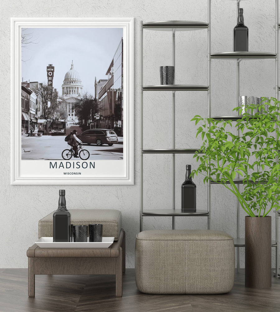 High-contrast black and white urban decor featuring a lone cyclist on State Street with the majestic dome of the Wisconsin State Capitol building rising behind trees, purchasable in an elegant black frame layout.