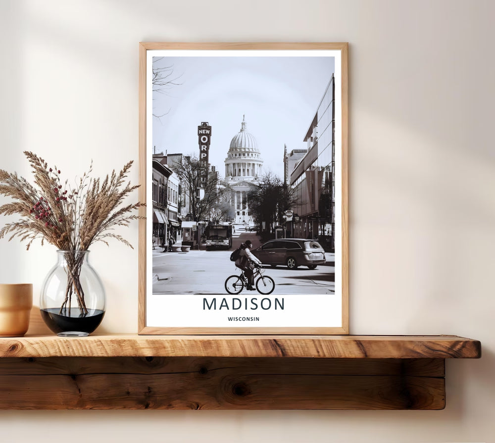 A unique monochrome street photography print of downtown Madison Wisconsin showing a city bus and classic storefronts lining State Street under a clear sky, available as an unframed poster or wrapped canvas art.