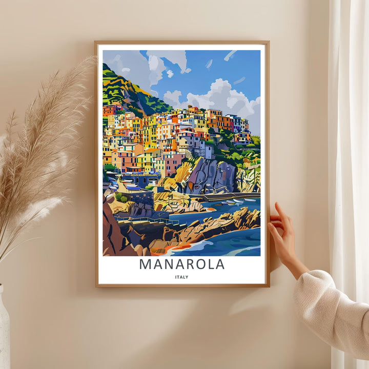 A bold graphic travel poster capturing the historic architectural beauty and dramatic sea cliffs of Manarola Cinque Terre Italy, ready to order as an unframed print or a natural wood framed art piece.
