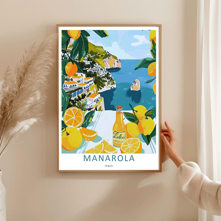 Refreshing Mediterranean decor featuring the coastal houses, blue sea, and trailing lemon branches of Manarola Cinque Terre Italy, purchasable as a wrapped canvas format or a premium white frame.