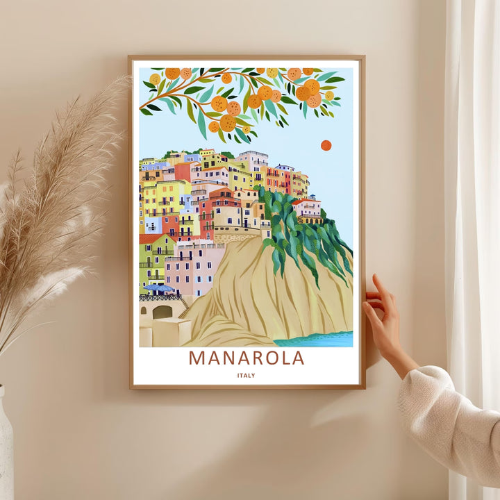 Whimsical Mediterranean decor featuring the pastel houses and trailing green vines of Manarola Cinque Terre Italy, purchasable as a wrapped canvas format or a premium white frame.