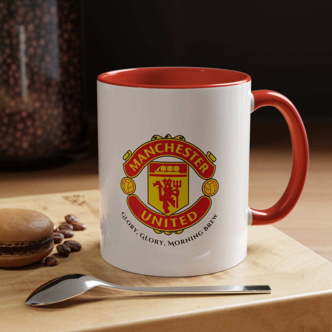 A red Manchester United mug featuring the official club crest in sharp detail. Perfect for Red Devils supporters, this ceramic coffee mug combines durability with fan pride. Ideal for daily coffee, tea, or hot chocolate, it brings the spirit of Old Trafford and Manchester United’s legacy into every sip at home, office, or game-day gatherings.