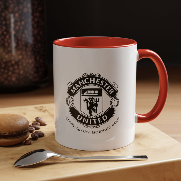 A red Manchester United coffee mug featuring the official club crest in vivid detail. The bold red color reflects the classic Red Devils identity while making the ceramic mug stand out. Perfect for coffee, tea, or hot drinks at home, office, or during match-day celebrations, this mug combines fan pride with daily functionality and collector appeal.