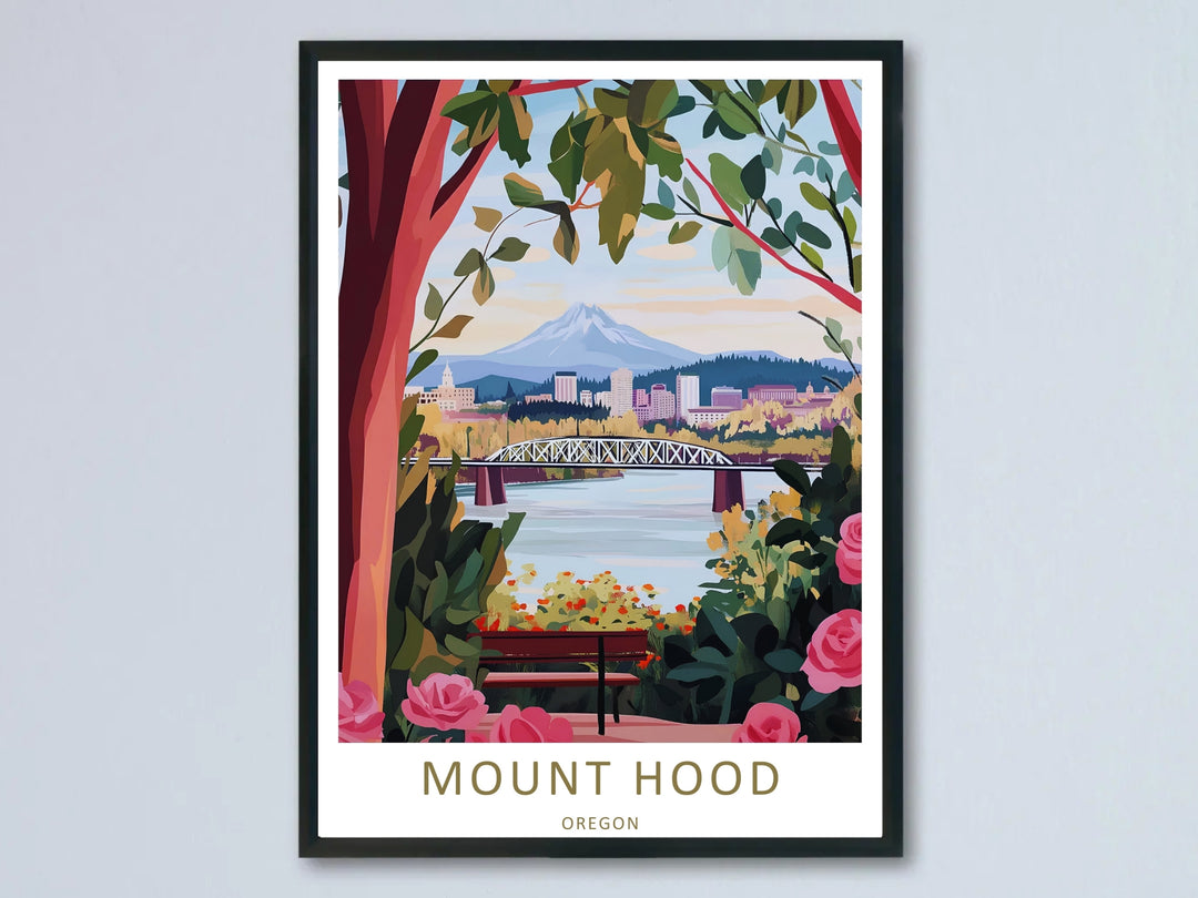 High-contrast graphic illustration of Mount Hood framed by pink roses and green leaves, shown in a modern black frame hanging on a neutral wall.