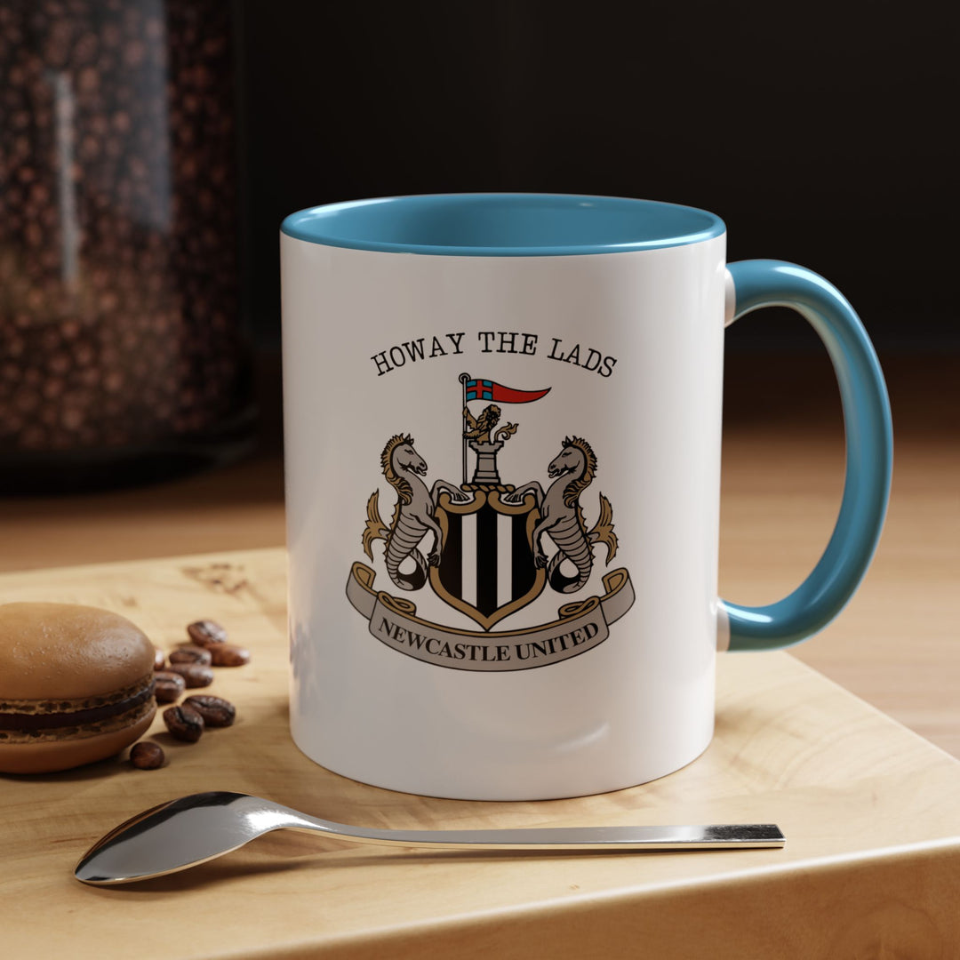 A blue Newcastle United coffee mug showcasing the official crest in clear, detailed print. The vibrant blue color contrasts beautifully with the emblem, highlighting Magpies pride. Ideal for coffee, tea, or hot drinks at home, office, or tailgates, this ceramic mug combines practicality with fan enthusiasm.