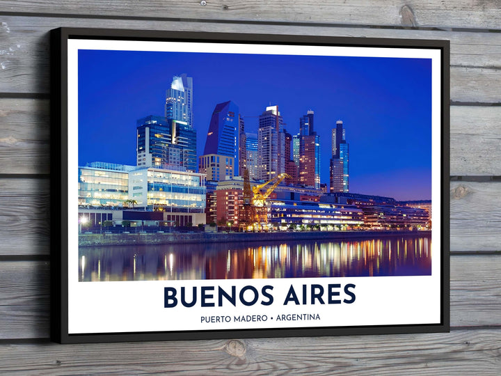 Overlooking the illuminated waterfront and glowing skyscrapers in Argentina, this Puerto Madero print captures deep cobalt twilight skies reflecting over calm harbor waters, available from MapYourDreams in flexible choices such as unframed paper, custom wooden frames, and gallery canvas wraps.