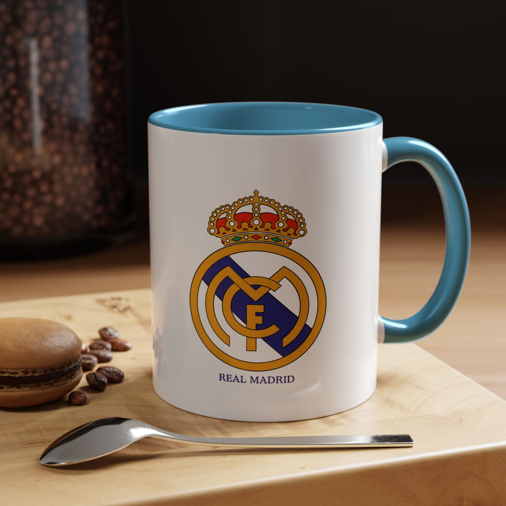 A Real Madrid FC mug crafted from high-quality ceramic with the iconic club emblem on display. Designed for fans who enjoy coffee, tea, or hot beverages while showing their Madridista pride. The deep blue finish adds a classic and elegant touch to any collection or daily routine.