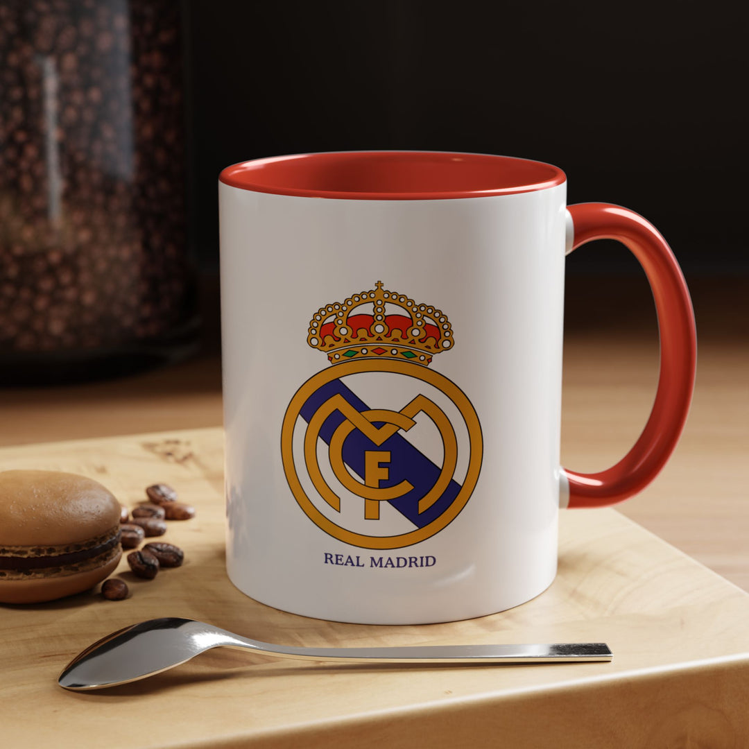 This ceramic Real Madrid FC mug features the official club logo, perfect for coffee, tea, or hot chocolate. Its durable construction and sleek design make it ideal for home, office, or match-day celebrations. The bold red color adds energy while showing loyalty to Los Blancos in a stylish way.