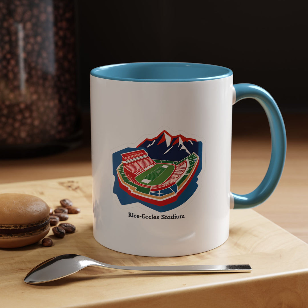 A blue Rice-Eccles Stadium mug showcasing a vivid artistic print of the Utah Utes stadium. The bright blue ceramic contrasts beautifully with the detailed stadium illustration, making it perfect for coffee, tea, or hot drinks at home, office, or game-day celebrations.