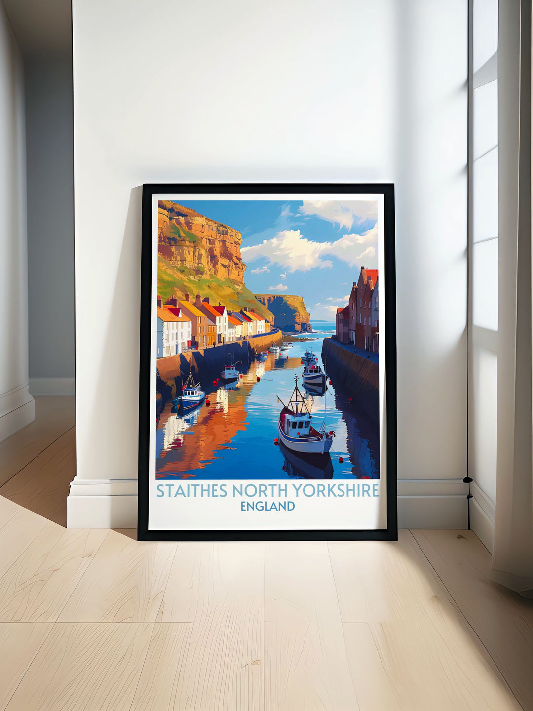 A picturesque view of Staithes Harbour with colorful fishing boats bobbing in the calm waters and charming cottages lining the rugged cliffs. The tranquil scene is perfect for adding coastal charm to any space.