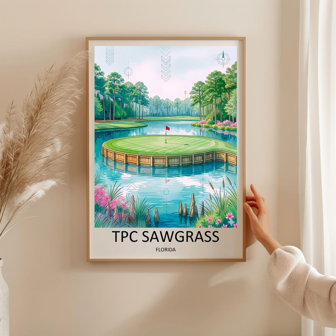 Framed watercolor poster of the famous TPC Sawgrass island green in Ponte Vedra Beach Florida, with cypress knees, azaleas, and tall pines reflected in calm blue water around the green.