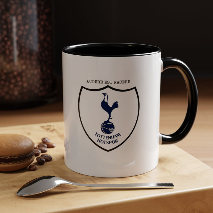 A black Tottenham Hotspur mug with the official club crest prominently displayed. The sleek black ceramic provides a modern and bold aesthetic while celebrating Spurs pride. Perfect for coffee, tea, or hot drinks at home, office, or match-day gatherings, making it a must-have for supporters.
