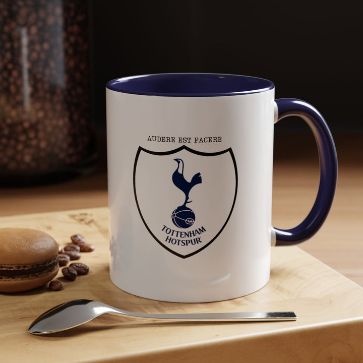 A navy blue Tottenham Hotspur mug featuring the official club crest in vivid detail. The deep navy tone gives a classic and timeless look while highlighting the emblem. Ideal for coffee, tea, or hot chocolate, at home, office, or during game-day celebrations for Spurs supporters.