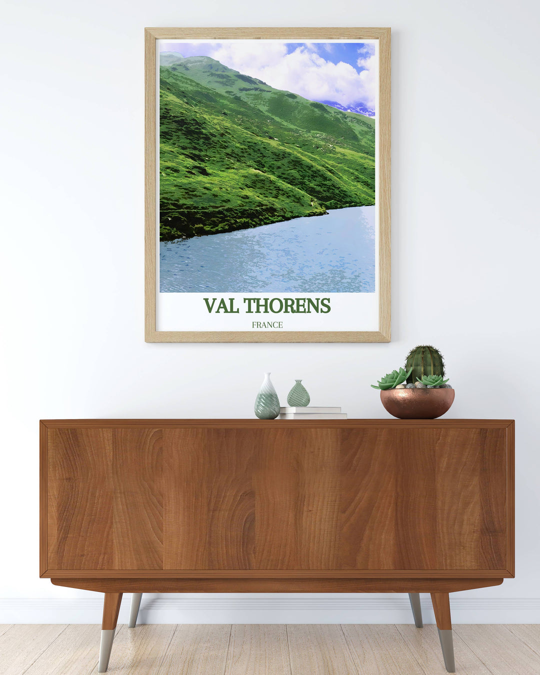 Scenic travel poster of Lac du Lou in Val Thorens, highlighting the serene waters and majestic alpine backdrop. Adds a touch of tranquility and adventure to your wall decor.
