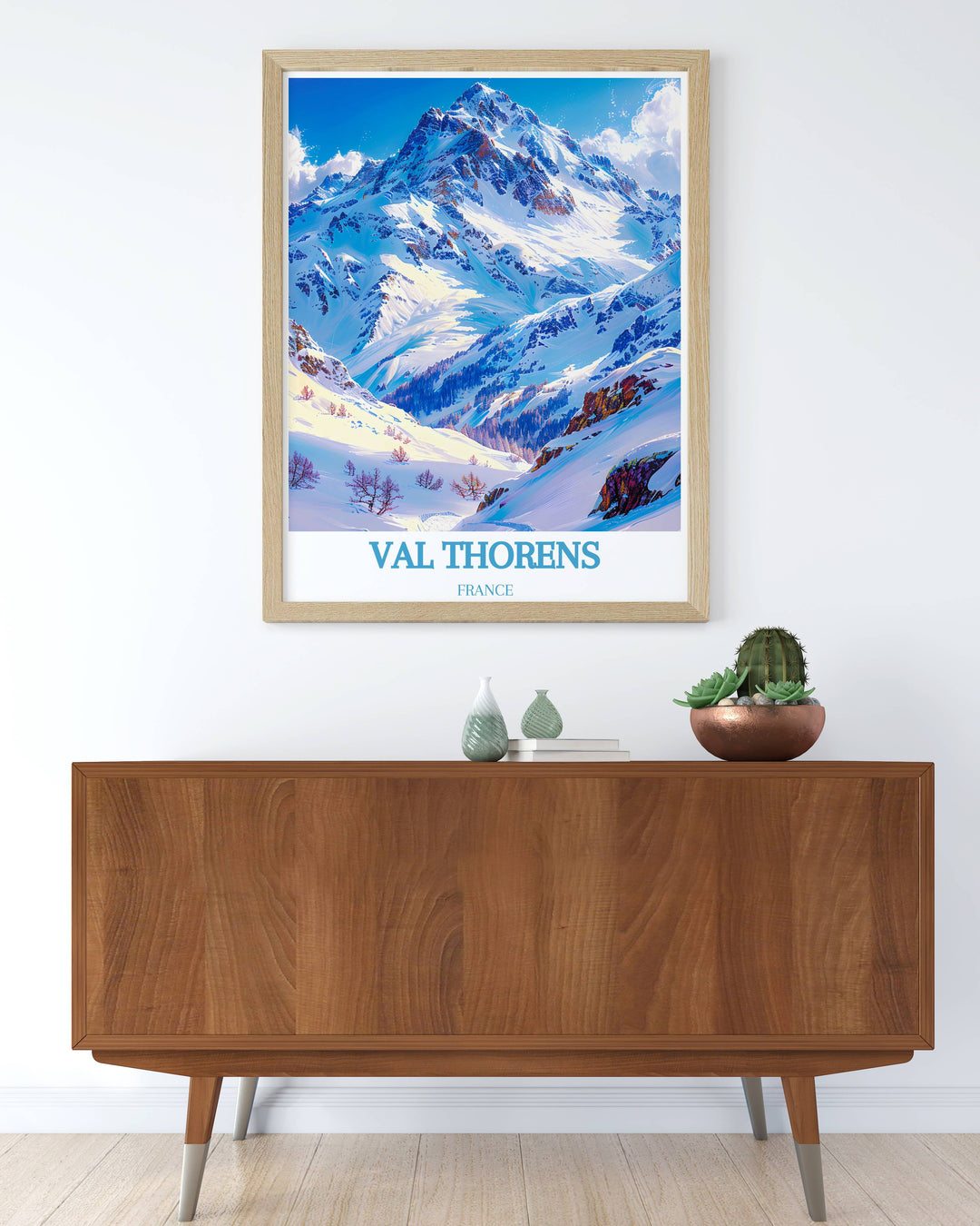 Stunning travel poster of Cime Caron, highlighting the snow covered peaks and vibrant alpine village of Val Thorens. Adds a touch of adventure and elegance to your wall decor.