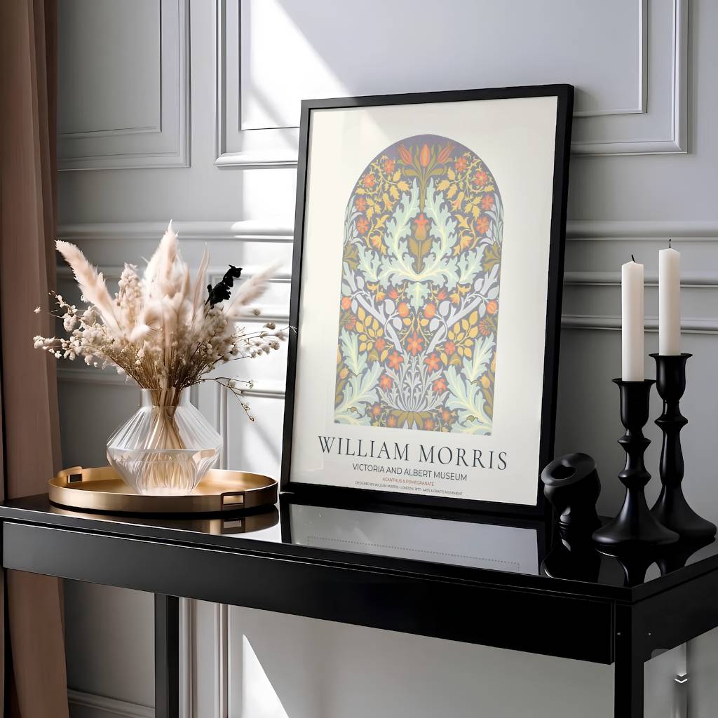 Decorative artwork print of William Morris Acanthus and Pomegranate featuring dense leafy scrollwork inside an arch design, soft pastel highlights, and a clean cream border for elegant wall arrangements.