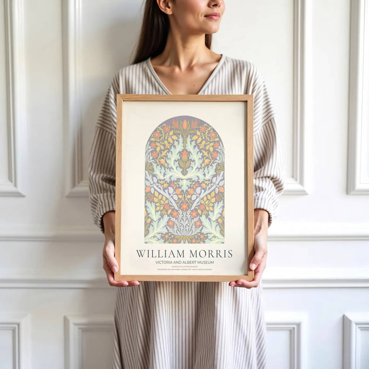 Modern decorative floral print of William Morris Acanthus and Pomegranate featuring intricate leaves, pastel blossoms, and an arched border layout, perfect for light filled contemporary spaces.