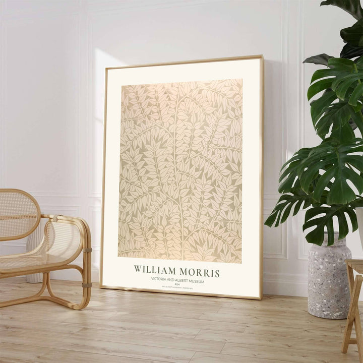 Elegant William Morris floral print capturing an 1875 vintage exhibition design with pale cream ash leaf motifs to enhance traditional or modern home interior design.