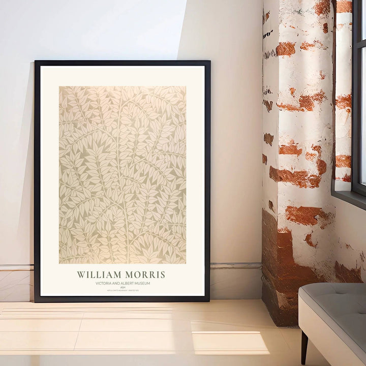 Decorative wall art print of William Morris Ash sage green leaf poster set against a clean cream margin, bringing timeless vintage British botanical elegance into home interior spaces.