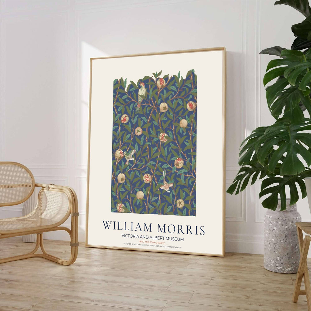 Detailed artwork print rendition of the iconic William Morris Bird and Pomegranate poster, highlighting rich navy, terracotta, and olive green tones ideal for moody bedroom and dining room focal points.