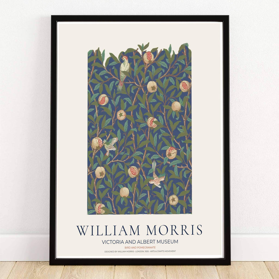 High quality William Morris Bird and Pomegranate navy floral print displaying delicate perching birds, ripe fruit, and dense leaves perfect for dark academia living room wall decor.
