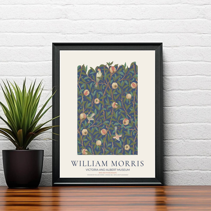 Classic William Morris Bird and Pomegranate navy print, adding a charming vintage flair and rich botanical detail to warm living room arrangements, entryways, and traditional interior spaces.