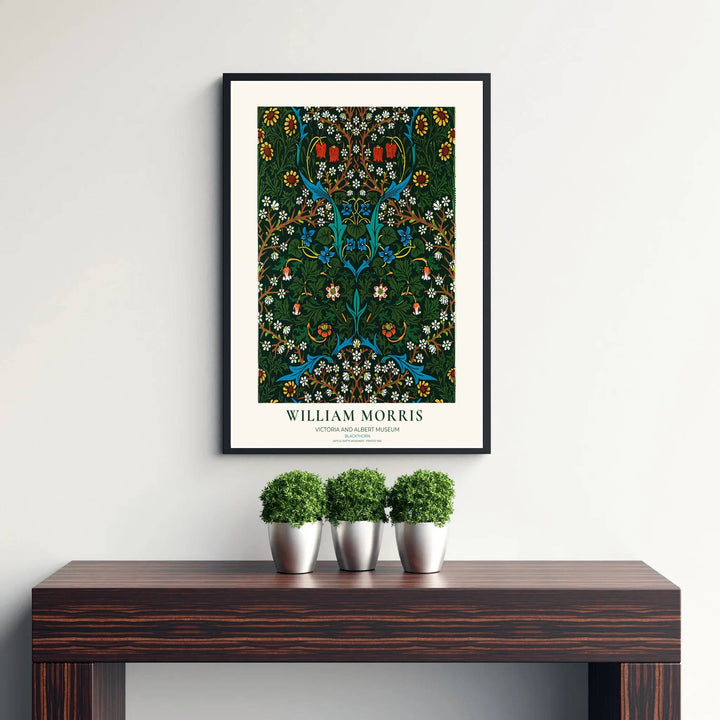 Decorative wall art print of William Morris Blackthorn dark green poster set against a clean cream margin, bringing timeless vintage British botanical elegance into home interior spaces.