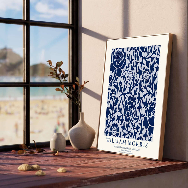 Detailed artwork print rendition of the iconic William Morris Chrysanthemum poster, highlighting high contrast navy, white, and light ice blue tones ideal for coastal living room focal points.