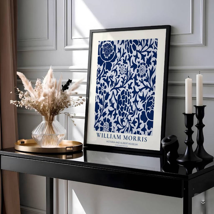 Elegant William Morris floral print capturing an 1877 vintage exhibition design with deep navy blue chrysanthemums on a white background to enhance traditional or modern home interior design.