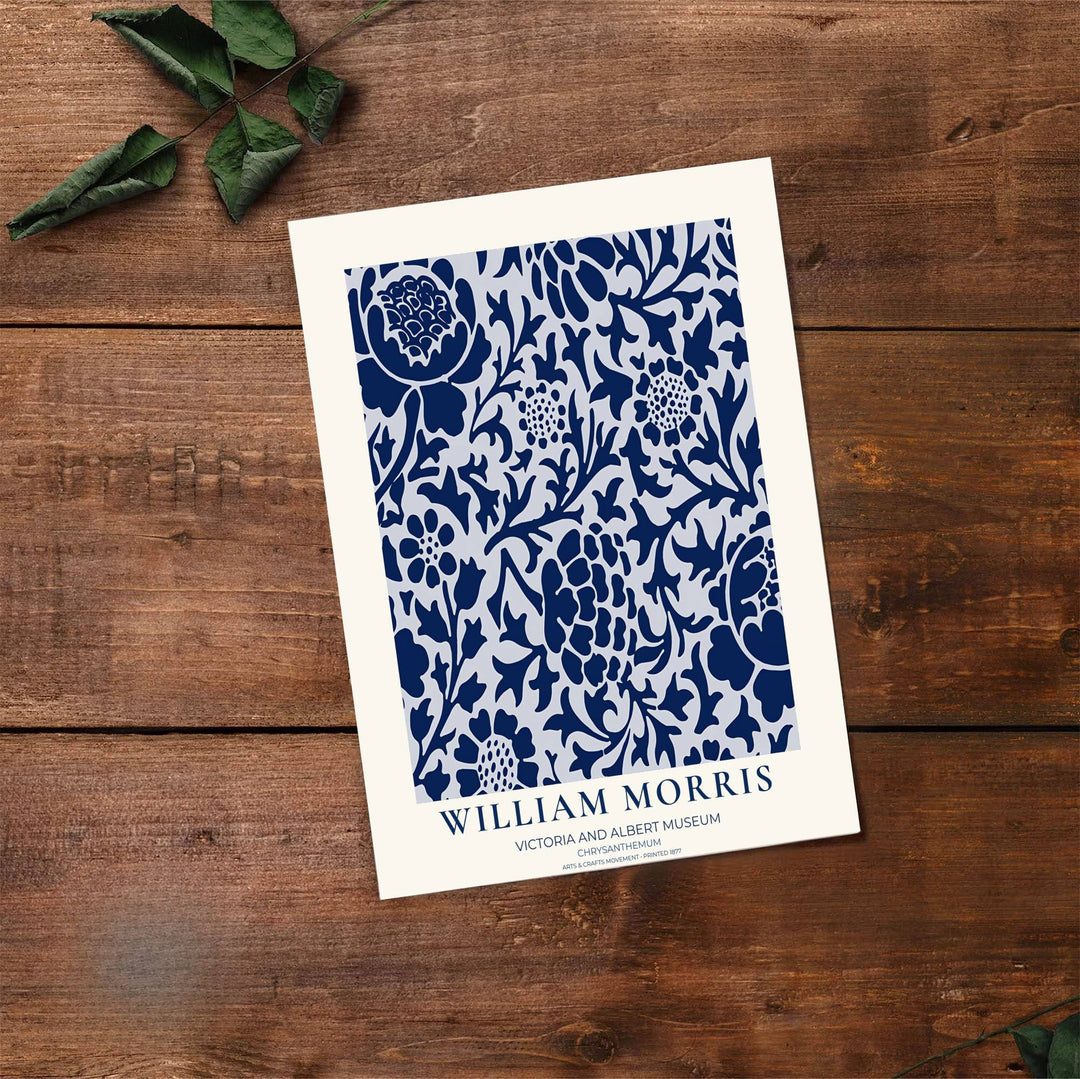 Decorative artwork print of William Morris Chrysanthemum featuring sweeping floral fills, navy blue highlights, and a clean cream border suitable for luxury interior styling and wall displays.
