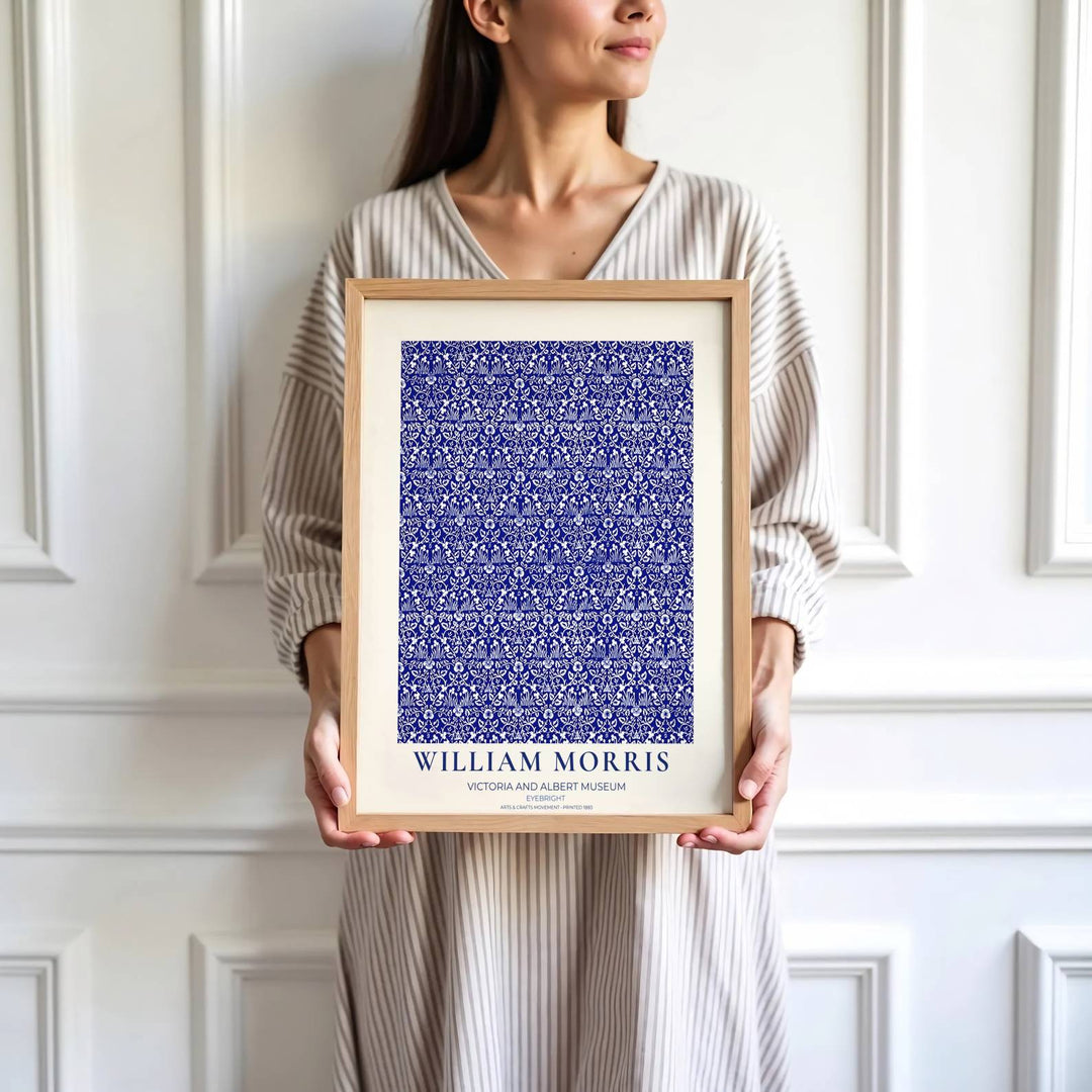 Fine graphic print featuring the detailed textile art of William Morris titled Eyebright, serving as a sophisticated centerpiece for Victorian, coastal, or blue-and-white room decor themes.