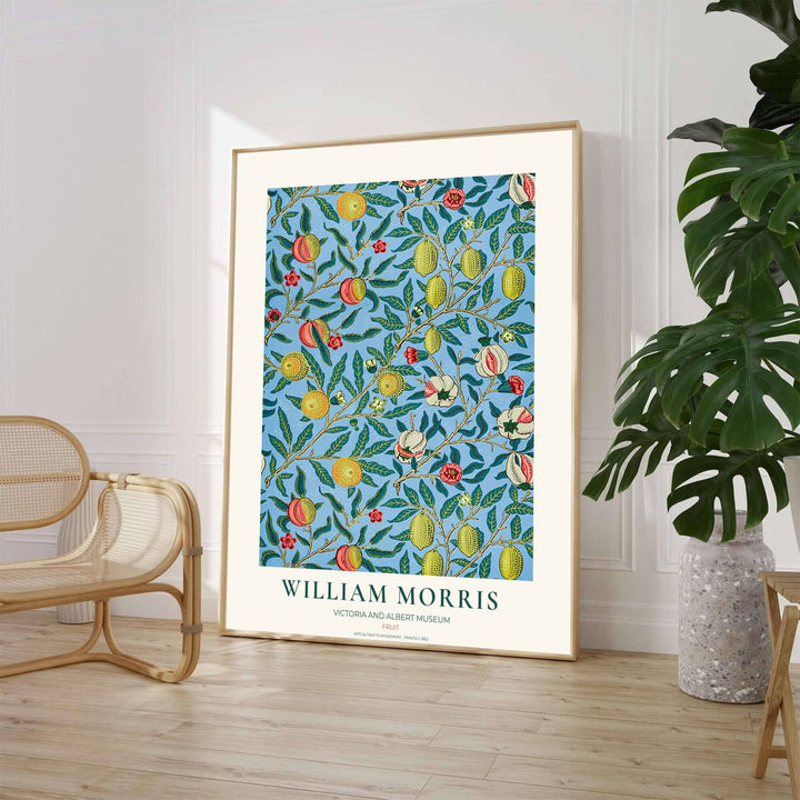 Elegant William Morris botanical print capturing an 1862 vintage exhibition design with sky blue background and lemon pomegranate motifs to enhance home interior design.