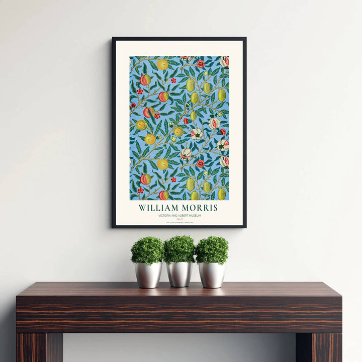 Mediterranean citrus orchard motif by William Morris featuring yellow lemons and red blossoms set against a light blue backdrop for vintage kitchen wall styling.