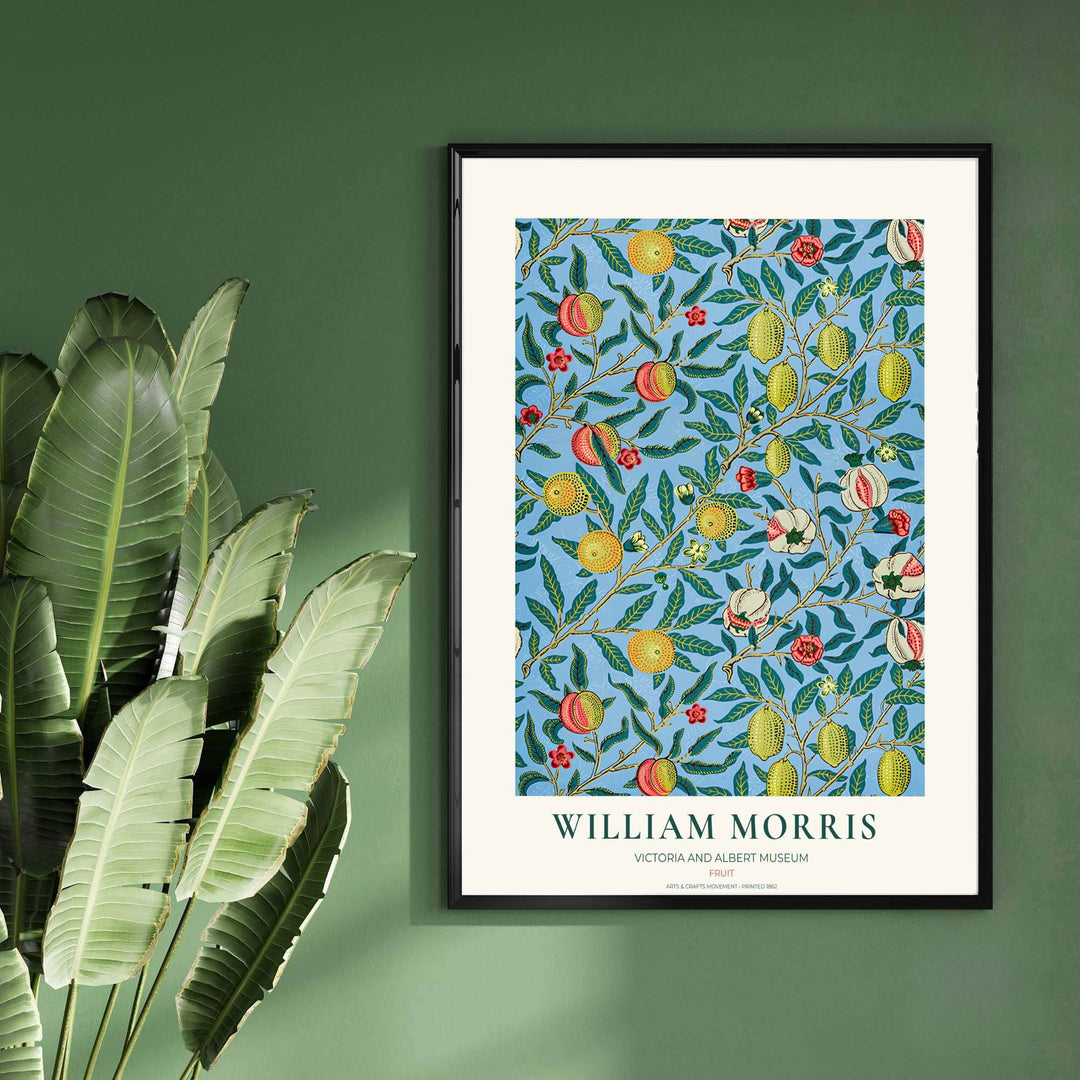 Close-up view of stylized citrus fruits, detailed leaves, and red floral accents from the famous William Morris Fruit poster designed in 1862.