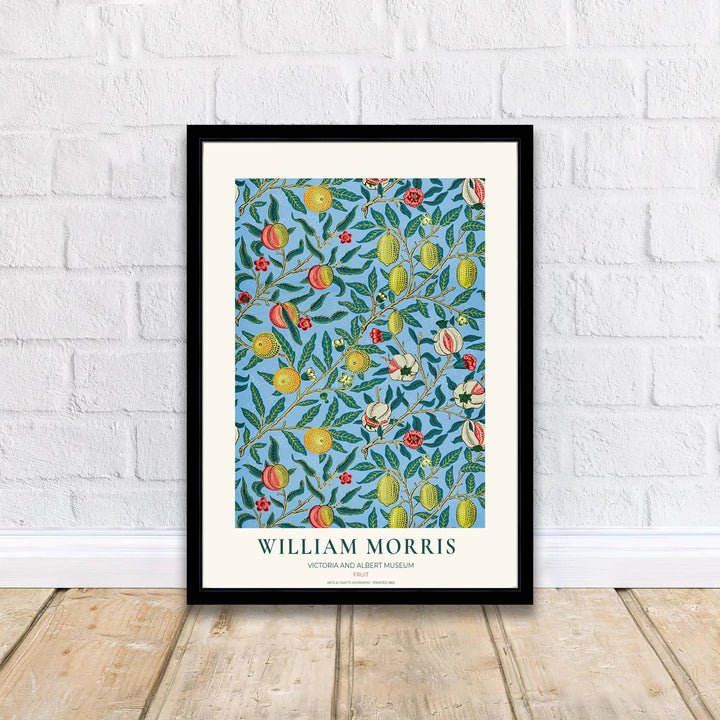 Bright sky blue botanical art print with yellow lemons, pink peaches, and burst pomegranates, perfect for adding cheerful Mediterranean warmth to dining room decor.