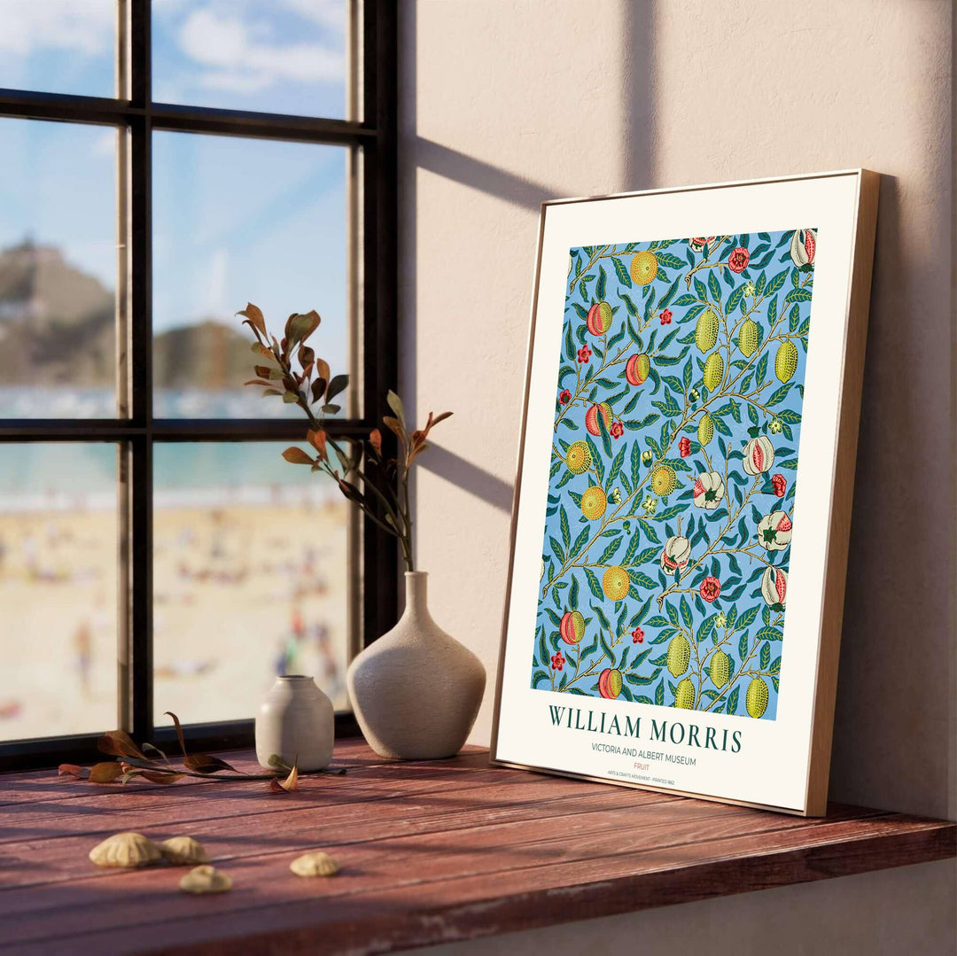 Historic Arts and Crafts Movement wall art print displaying the iconic Pomegranate pattern with rich botanical details and museum typography inside a cream border.