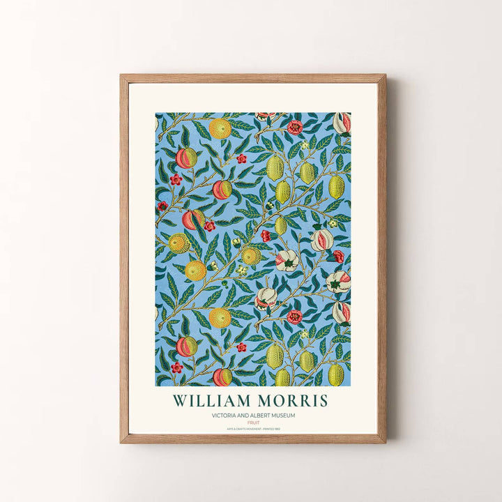 Colorful fruit tapestry print of William Morris illustrating ripe lemons and pomegranates, designed to coordinate effortlessly with blue and yellow interior color schemes.