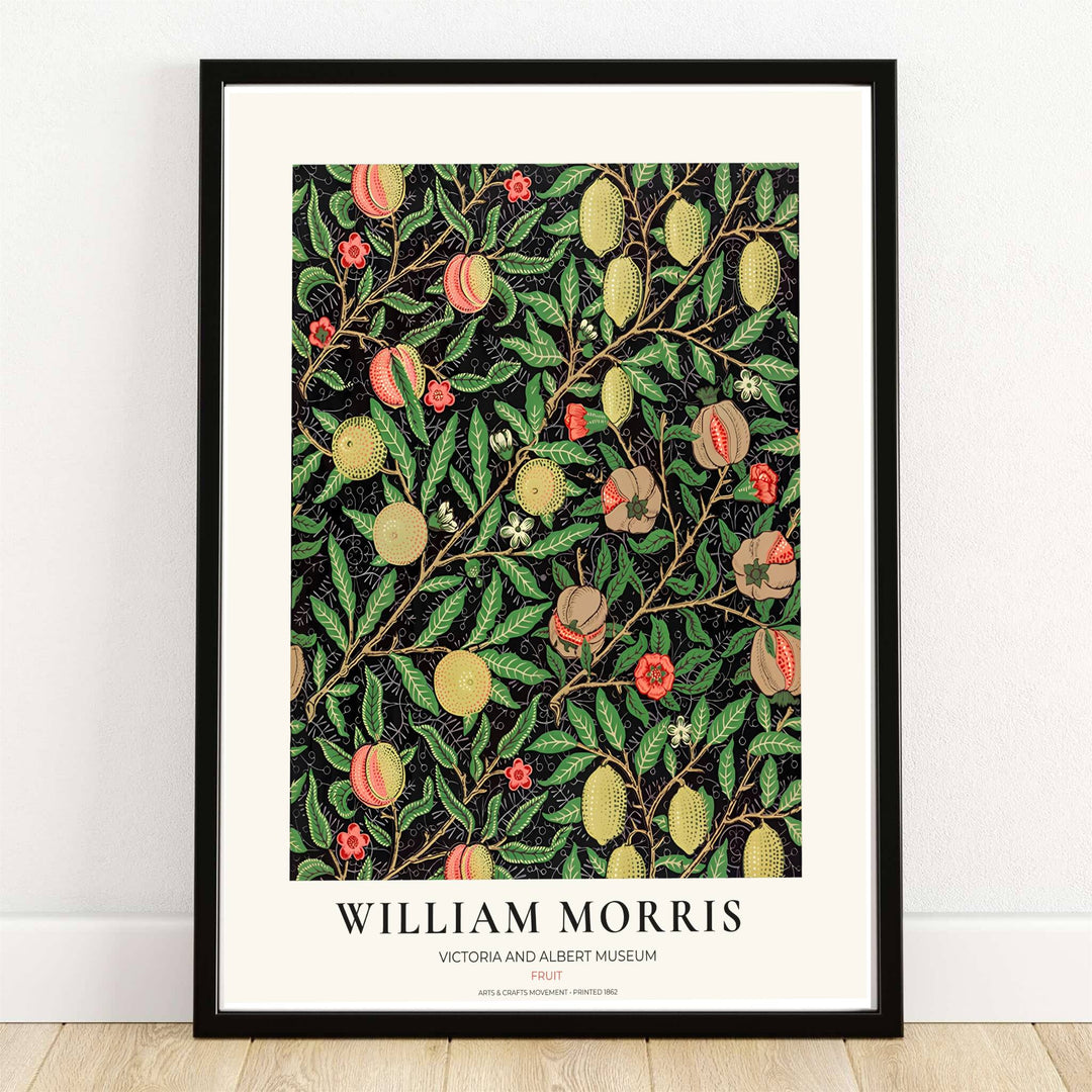 Ripe yellow lemons, blushing peaches, and open pomegranates on a deep black background in a dark academia William Morris Fruit botanical print.