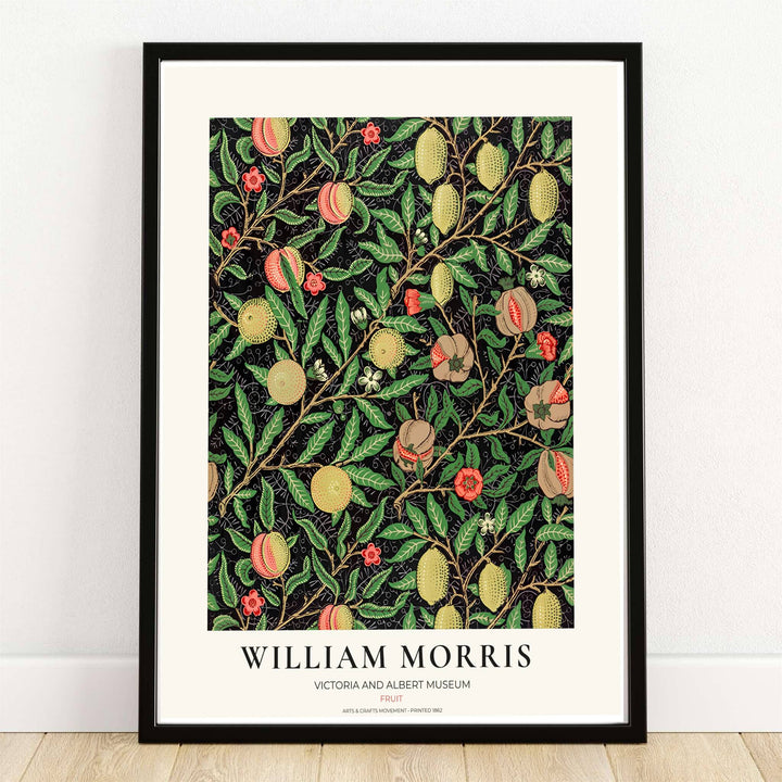 Ripe yellow lemons, blushing peaches, and open pomegranates on a deep black background in a dark academia William Morris Fruit botanical print.