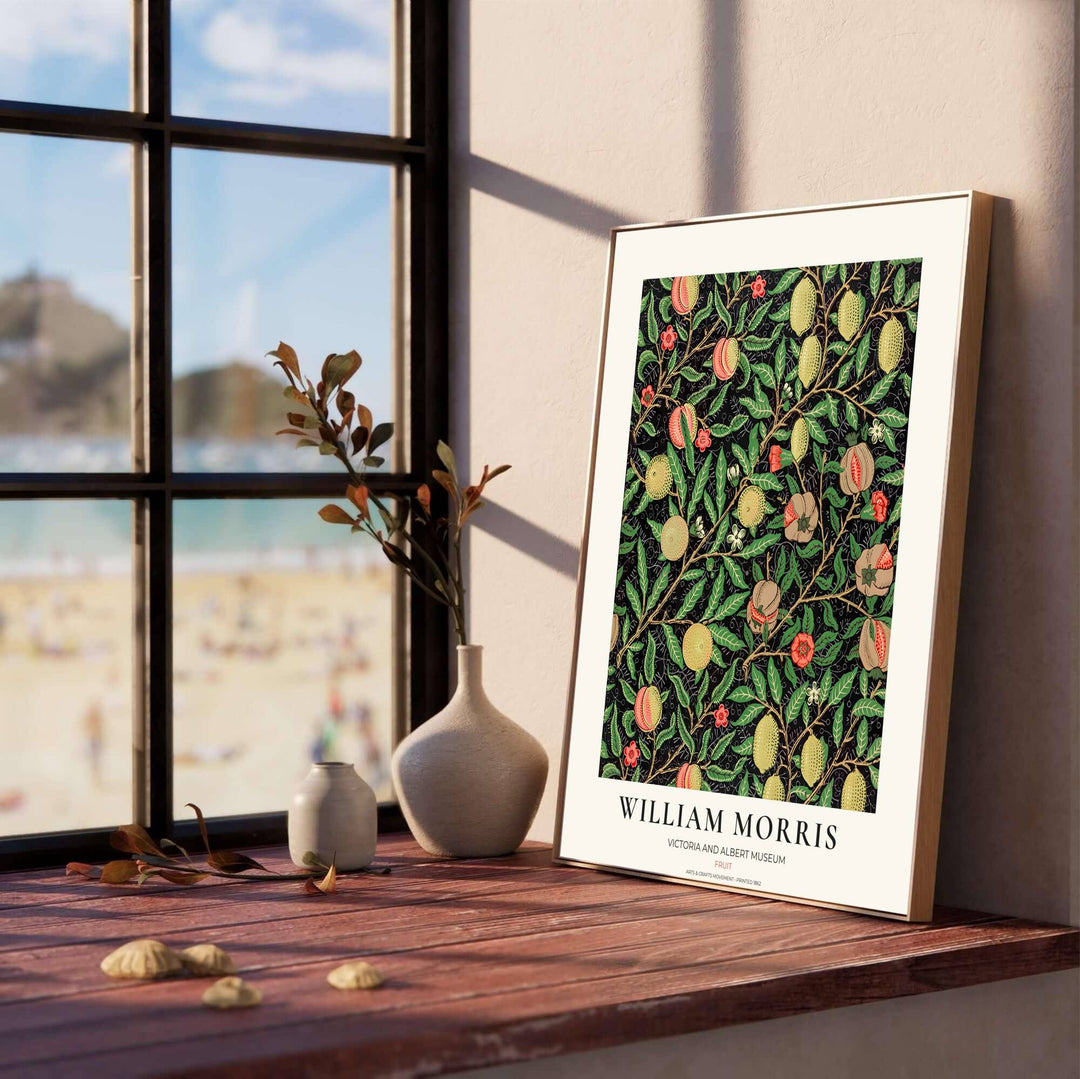 Dramatic black botanical art poster featuring William Morris lemons and pomegranates, perfect for styling moody dining room wall spaces.